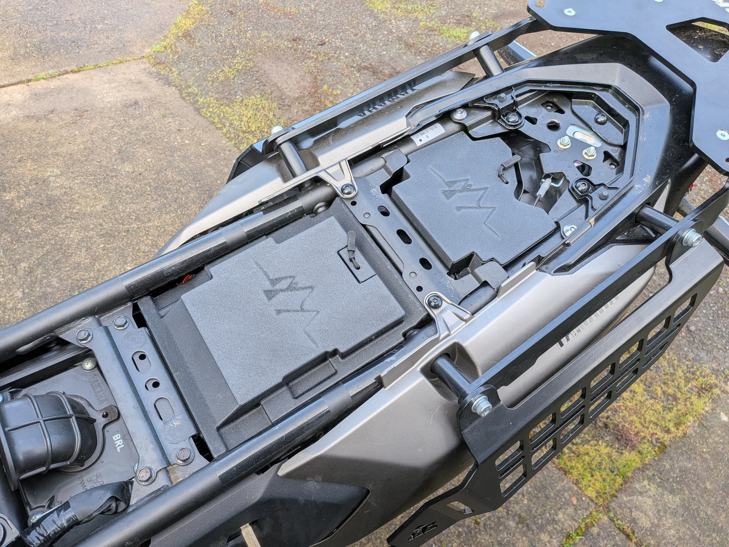 MotoCubby Nomad III and Drifter II installed on a 2025 Yamaha Ténéré 700 — wide view of both storage boxes mounted front and rear