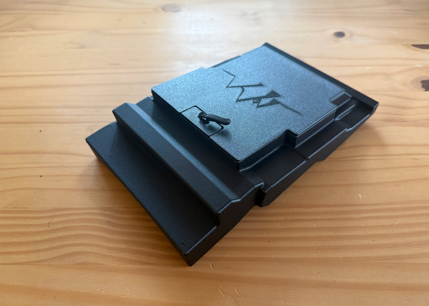 MotoCubby Nomad III under-seat storage for Yamaha Ténéré 700 — three-quarter view showing the lid seated on the box body and tabbed shell