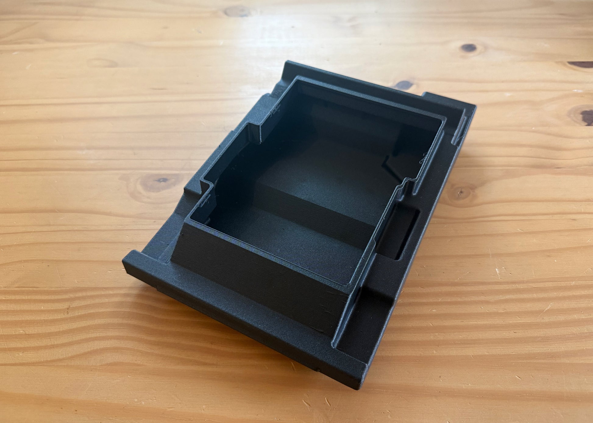 MotoCubby Nomad III under-seat storage for Yamaha Ténéré 700 — angled view of the empty box body without the lid