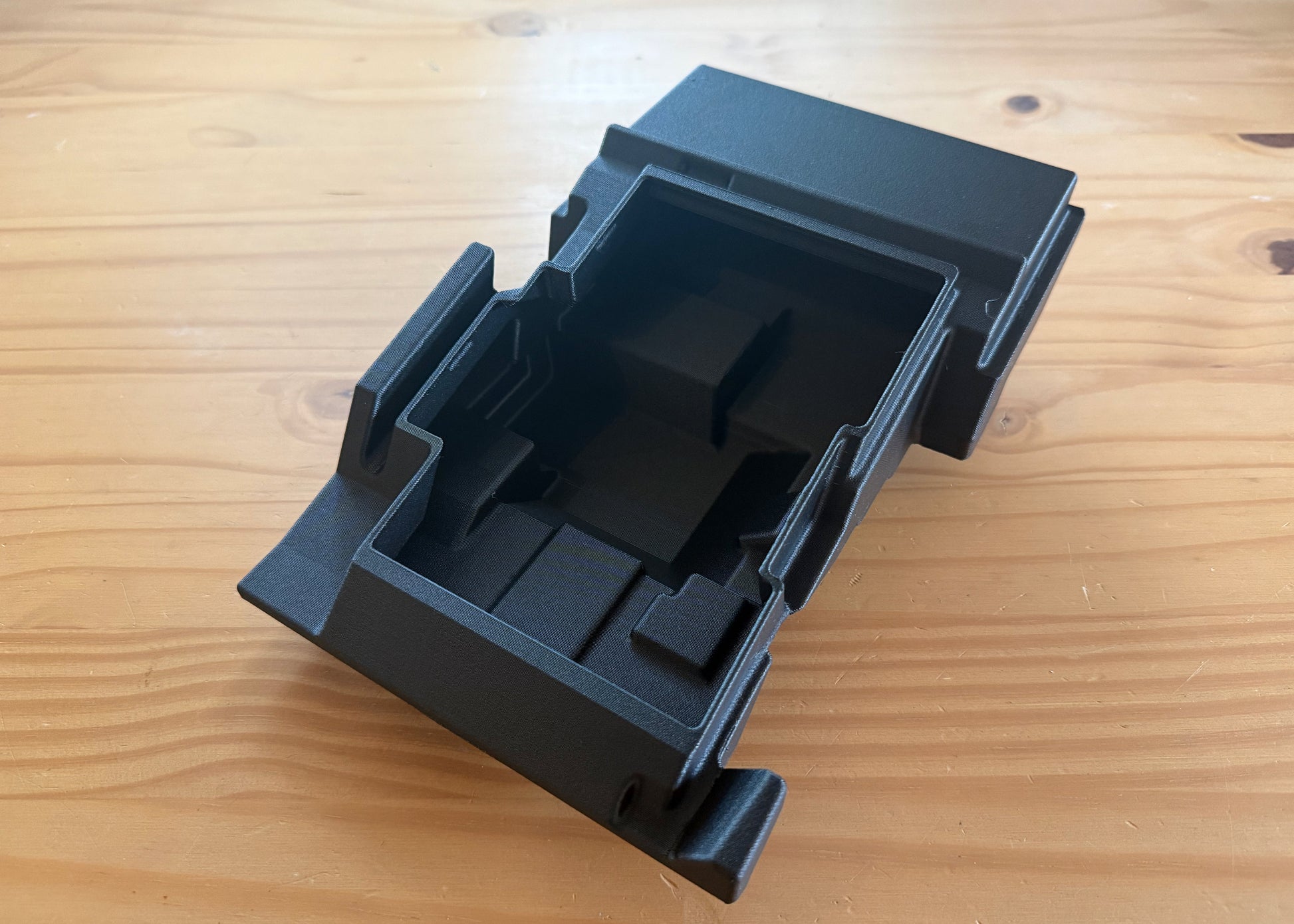 MotoCubby Nomad II interior view for Yamaha Ténéré 700 — top-down showing the molded battery pocket and antenna passthrough