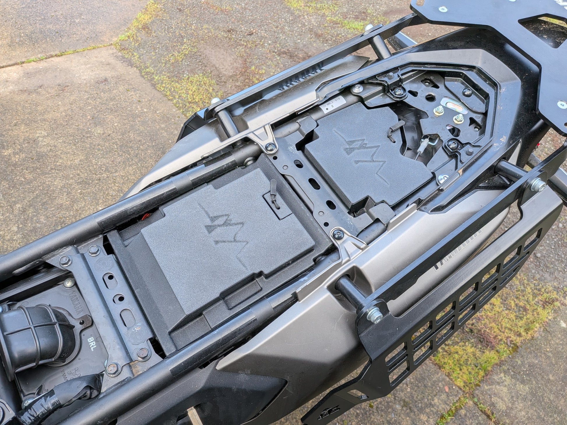 MotoCubby Nomad III and Drifter II installed on a 2025 Yamaha Ténéré 700 — wide view of both storage boxes mounted front and rear